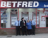 Some of the great staff at Betfred in Redhill Surrey with the Town Crier, Richard Palmer