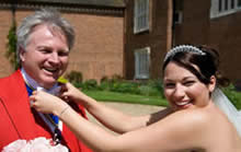 Toastmaster Richard Palmer getting a helping hand from a very happy bride