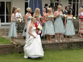 Bride with Bride's Maids and Toastmaster during the photo session