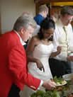 Toastmaster Richard Palmer carrying the brides food for her 